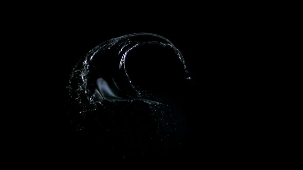 Water splash against black drop, Slow Motion