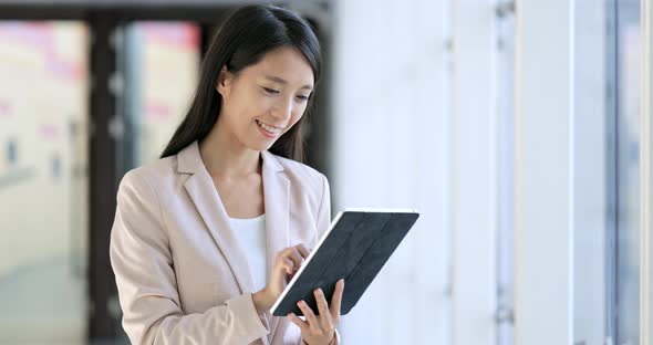 Business woman working on tablet computer 