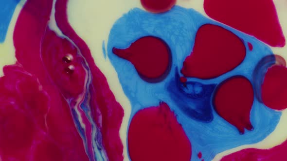 Abstract close up texture of oil with blue, red and yellow paint alt