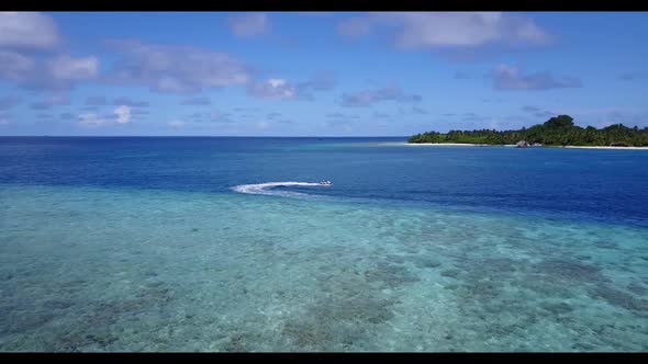 Aerial abstract of marine coast beach trip by aqua blue ocean with white sandy background of a dayou