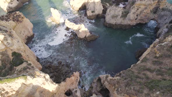 Limestone cliffs and rocks, coast of Lagos, Algarve.  Walkway to the beach