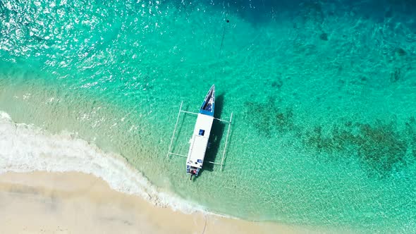 Luxury flying clean view of a sunshine white sandy paradise beach and aqua blue water background in 