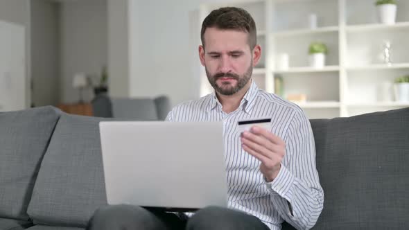 Young Man Having Online Payment Failure on Laptop at Home