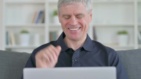 Middle Aged Businessman Doing Video Call on Laptop 