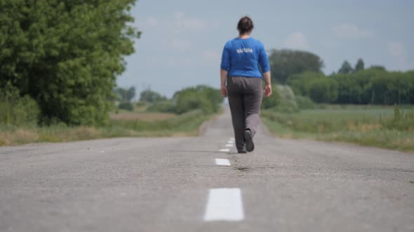 An Asphalt Road. Movement Along the Road Marking Line.