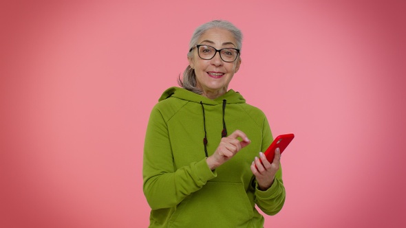 Elderly Granny Woman Use Mobile Phone Browsing Online Say Wow Yes Big Win News Doing Winner Gesture