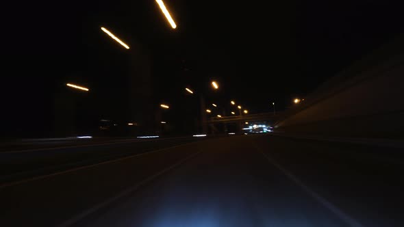 The Car Driving On The Night City Road Hyperlapse. Trip Travel Concept. 