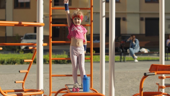 Young Cute Child Girl in Sportswear Making Fitness Gymnast Exercises on Playground, Workout for Kids