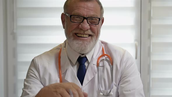 Portrait of a Mature Experienced Doctor During a Consultation