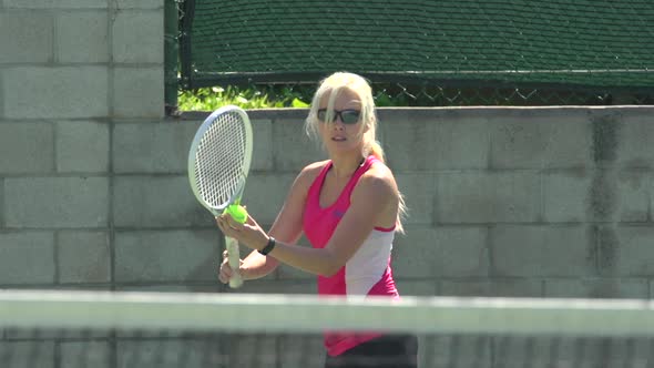 Women playing tennis.