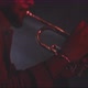 Profile view of a trumpeter playing in backlit and red neon lights - VideoHive Item for Sale