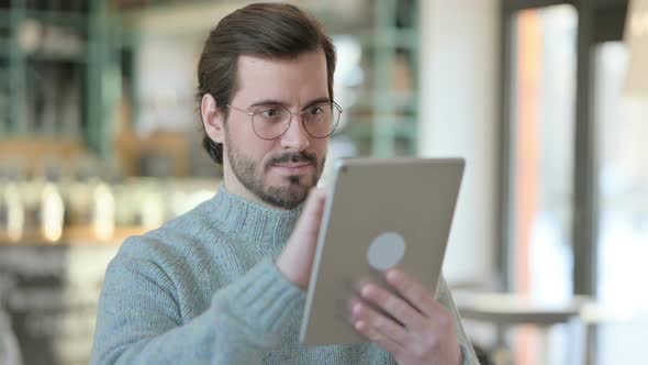 Portrait Young Man Using Digital Tablet