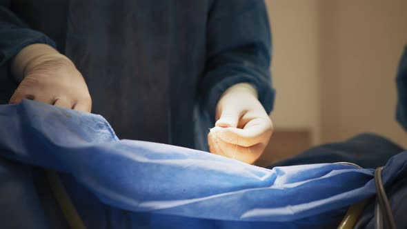 Closeup on Professional Surgeon Suture Wound After Successful Surgery