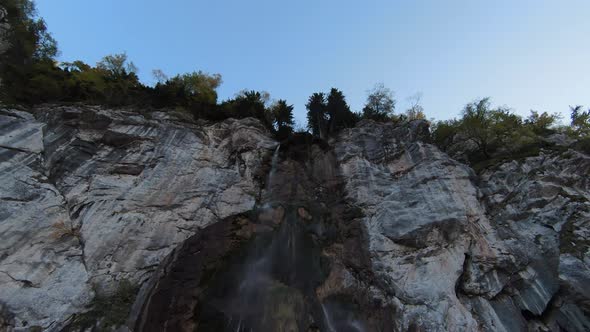 Aerial View of Autumn Waterfall Flying Over Forest in the Autumn Big Stones in the River Waterfall