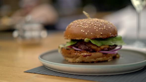 Gimbal Pan Shot Left To Right of a Fresh Burger on a Plate