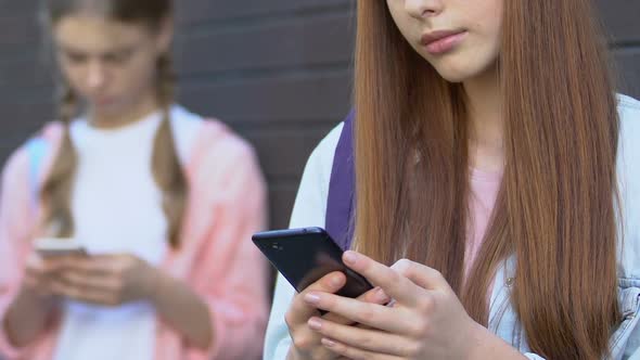 Teenage Girls Using Cellphones, Ignoring Live Communication, Gadget Addiction