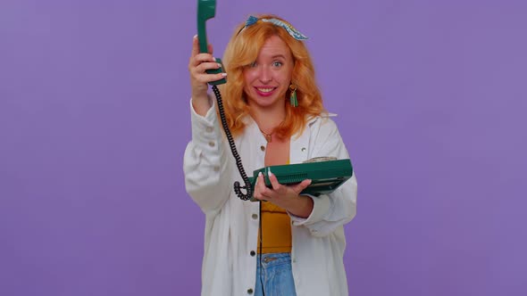 Cheerful Redhead Girl Secretary Talking on Wired Vintage Telephone of 80s Says Hey you Call Me Back