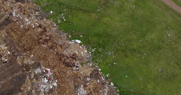 Environmental Pollution - Plastic Bottles, Bags And Trash In Green Field - aerial shot