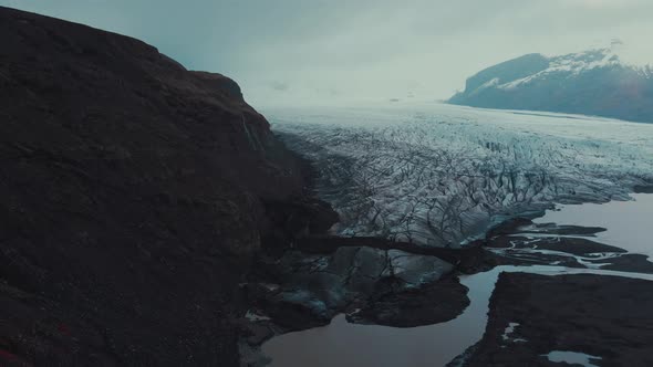 Huge glacier in cold gloomy valley