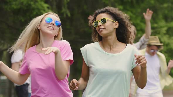 Two Happy Female Dancers Enjoying Party Outdoors, Friends Hanging Out in Park