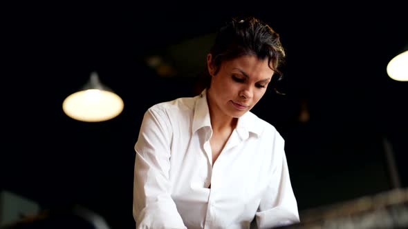 Woman is Kneading and Rolling Out Clay or Dough Working in Kitchen or Pottery Workshop