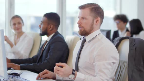 Male Office Worker Exercising with Expander