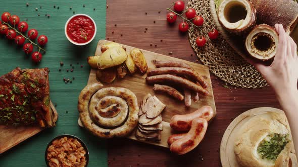 Taking Trdelnik and Meat with Fork Top View