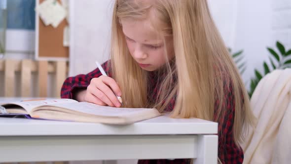 Blonde Schoolgirl Studying at Home Doing School Homework