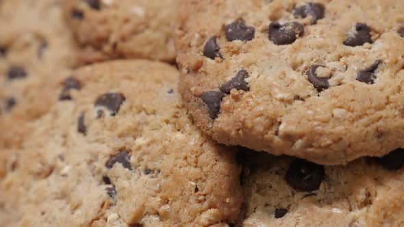 Fresh made biscuit chip cookies with chocolate close-up slow tilt 4K 2160p 30fps UltraHD footage - L