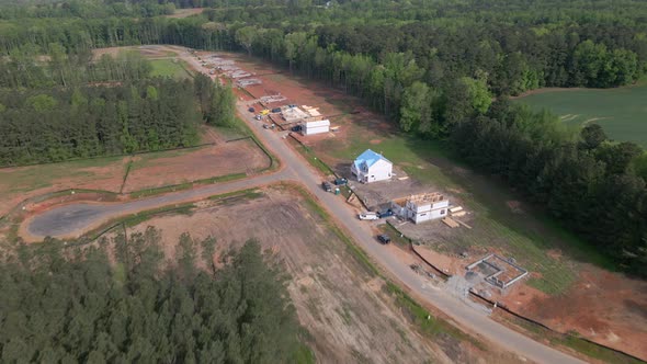 Cinematic drone shot of homes being built, new construction