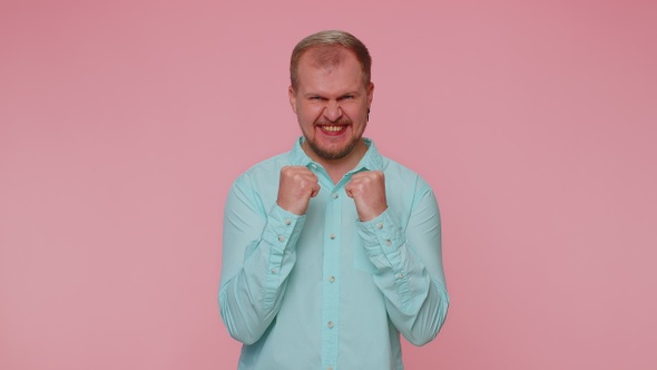 Stylish Man in Shirt Shouting Raising Fists in Gesture I Did It Celebrating Success Winning