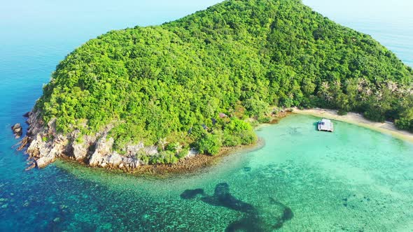 Beautiful birds eye abstract shot of a white sand paradise beach and aqua blue ocean background in h