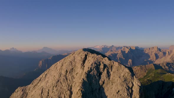 Epic steep South Tyrol Plose Peitlerkofel mountain peak during golden hour aerial view across majest