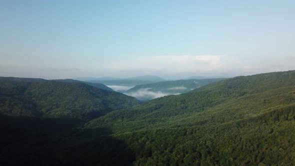 Aerial Landscape View of Caucasus Mountain at Sunny Morning with Fog