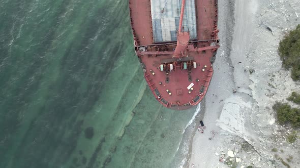 Cargo Ship Standing at Shoal of Sand Beach After Run Aground