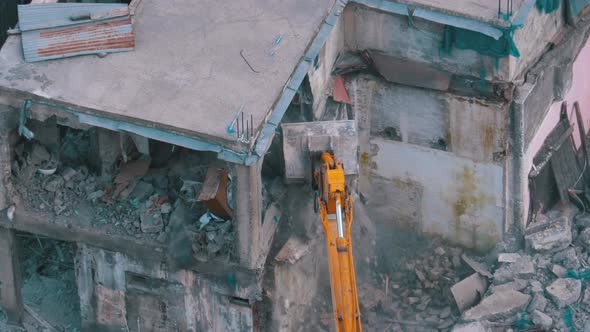 Destroying Old House Using Bucket Excavator on Construction Site. Slow Motion. alt