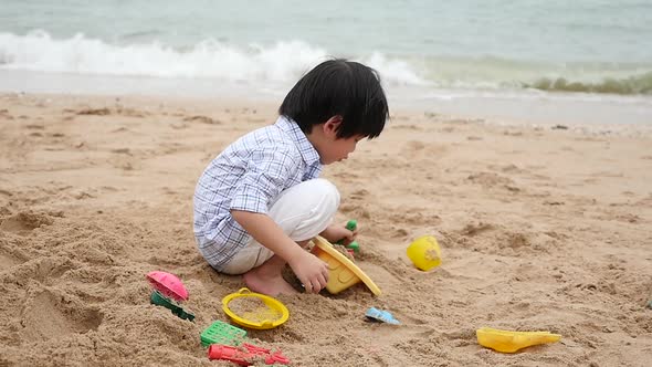 Cute Asian Child Playing On The Beach Slow Motion