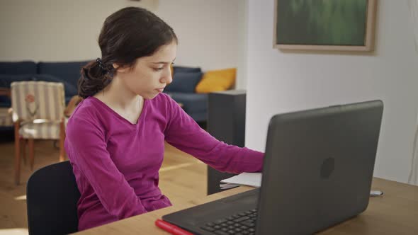 Teenage girl attending an online lesson during the COVID-19 lockdown