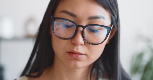 A Woman Freelancer Works at Home Using a Laptop