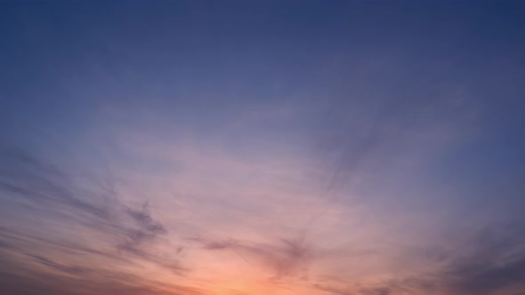 4K UHD : Time lapse of colorful sky during beautiful sunset. Romantic clouds.