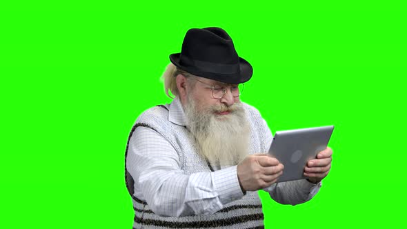 Energetic Elderly Man Playing Online Computer Game