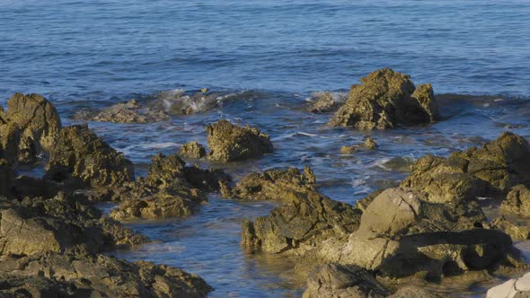 Blue sea, brown rocks