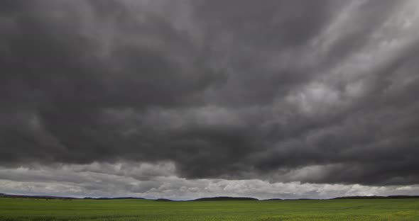 Storm Clouds In A Green Timelapse Field