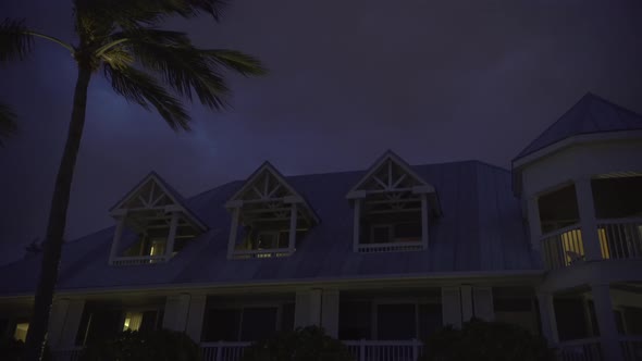 Pan right of houses tops at night