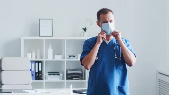 Professional medical doctor working in hospital office using computer technology.