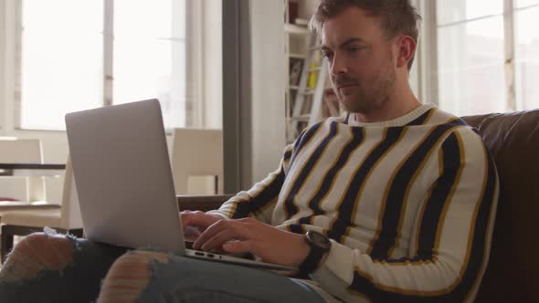 Caucasian male in social distancing working at home