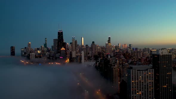 Downtown Chicago Cityscape at Sunset with Fog on Lake Michigan