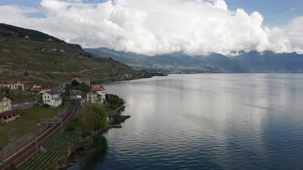 Aerial of beautiful buildings near beautiful lake in Swiss countryside