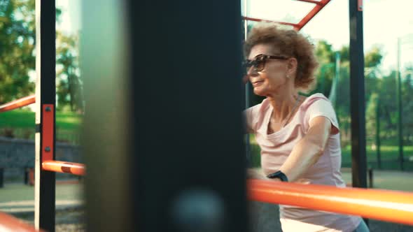 Senior Woman Working Strength Training Push Ups Outdoor