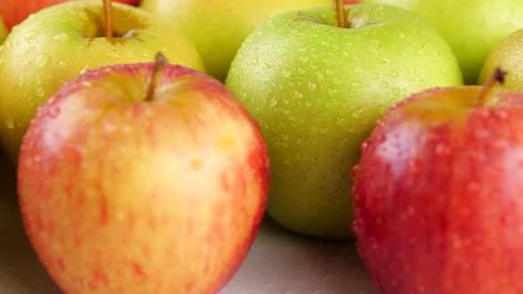 Bunch of Wet Apples on Table